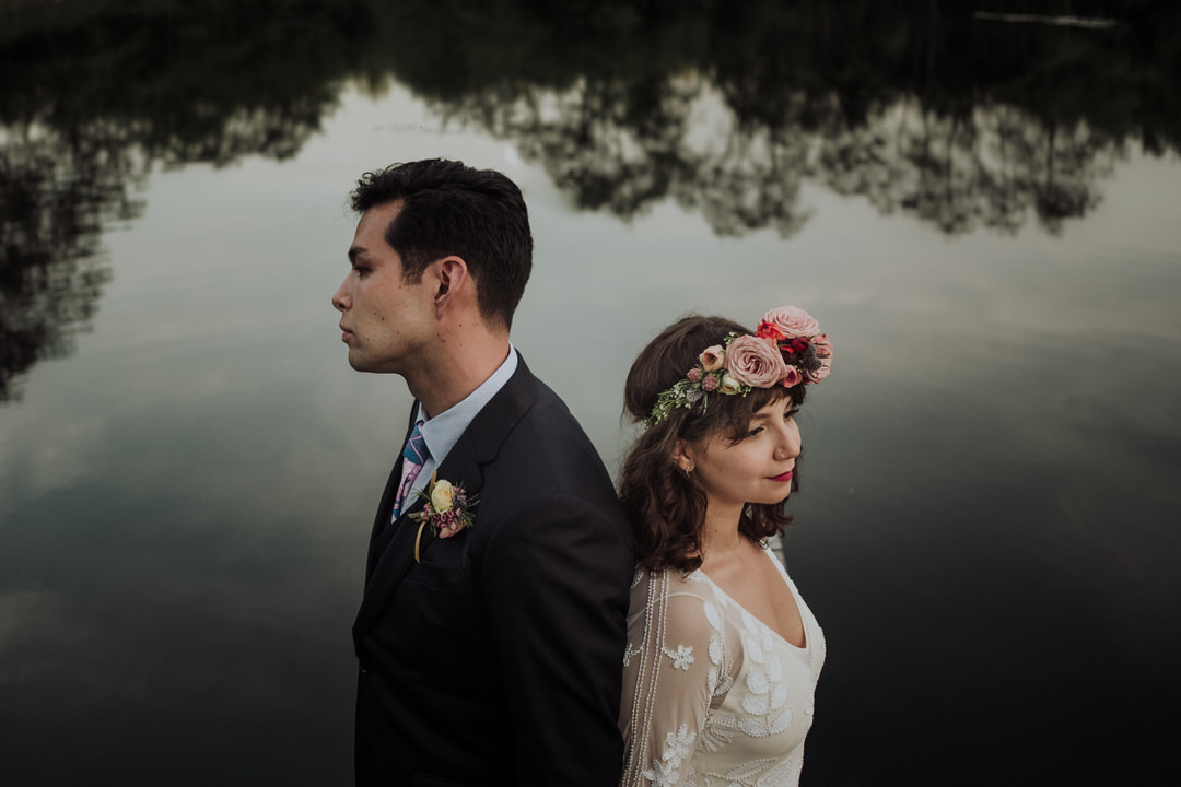 couple of front of a pond