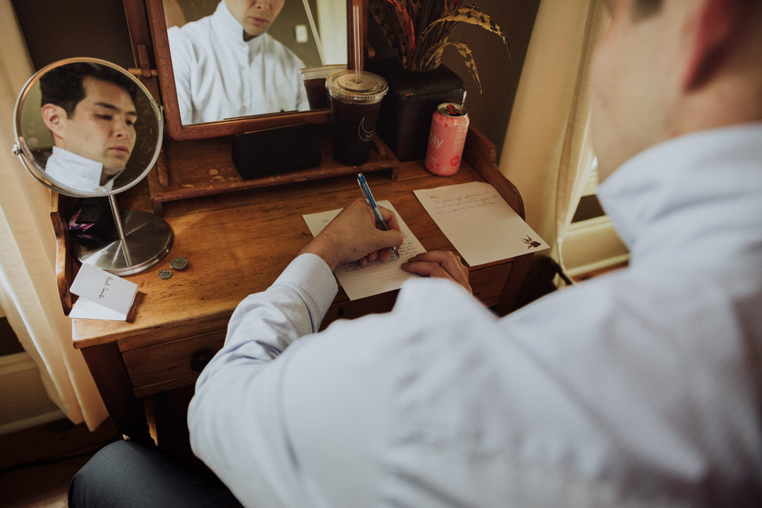 groom writing his vows