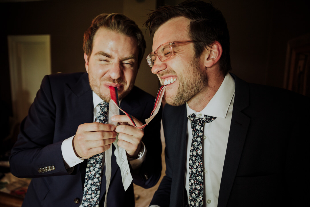 groomsmen sharing a fruit by the foot