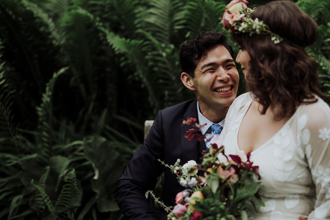 bride and groom laughing