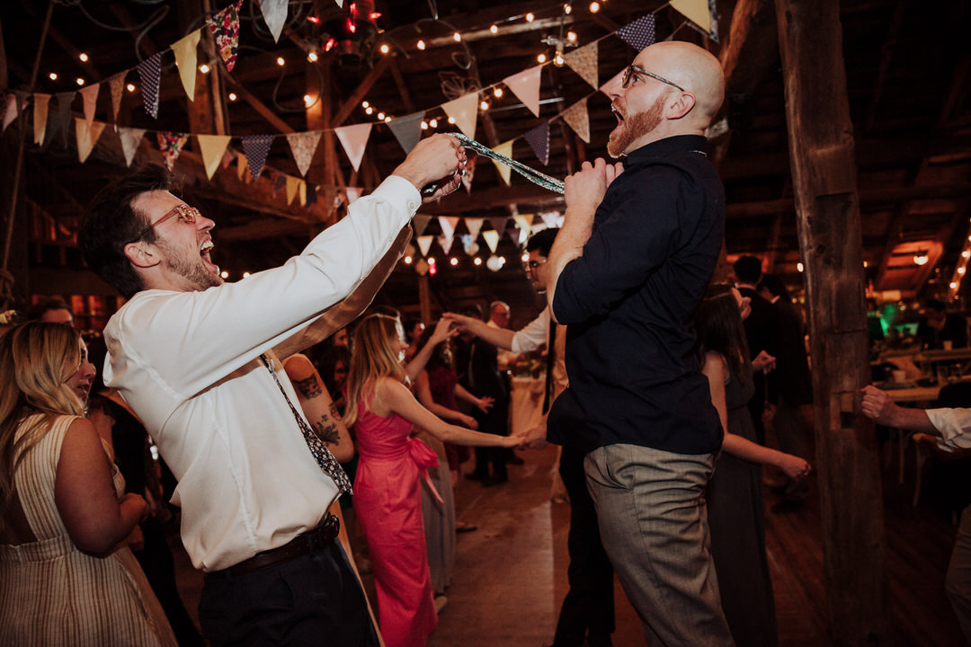 groomsmen dancing during wedding reception