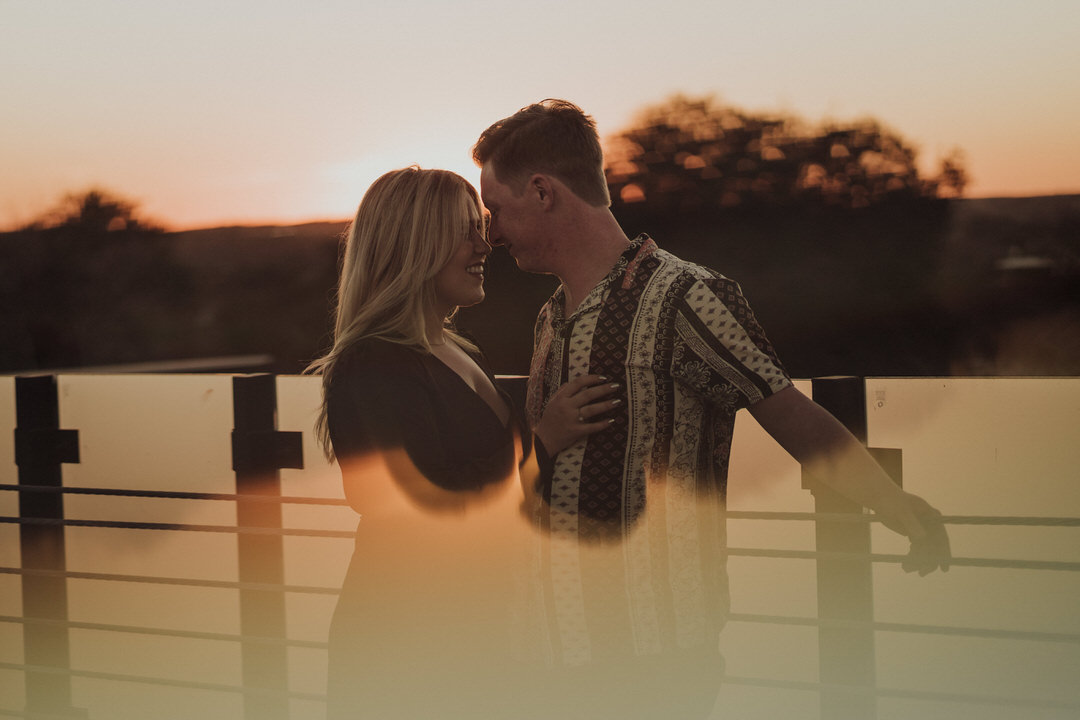 sunset rooftop portrait of couple