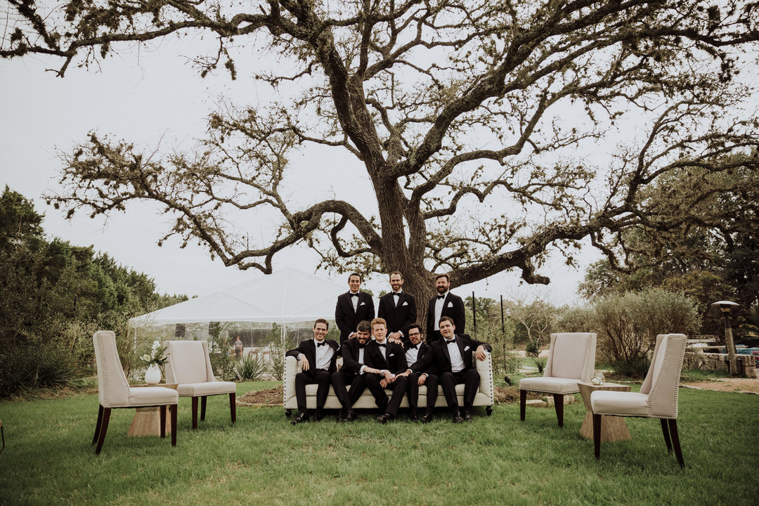 groomsmen image under a large tree