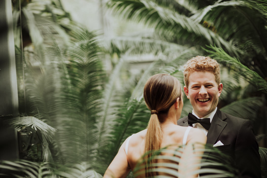 groom laughing with bride