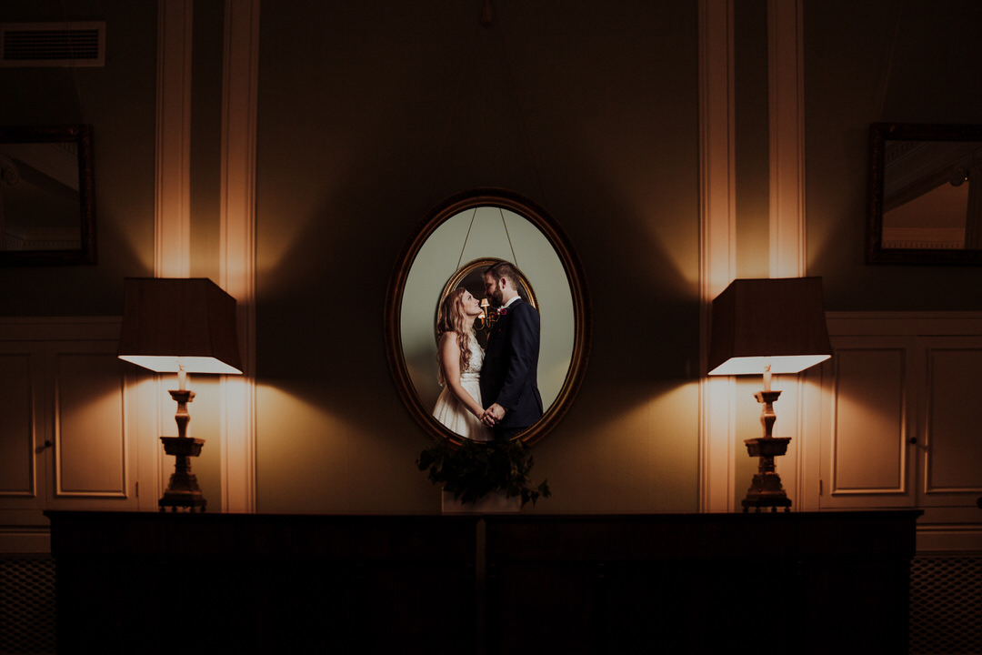 creative portrait of couple in mirror
