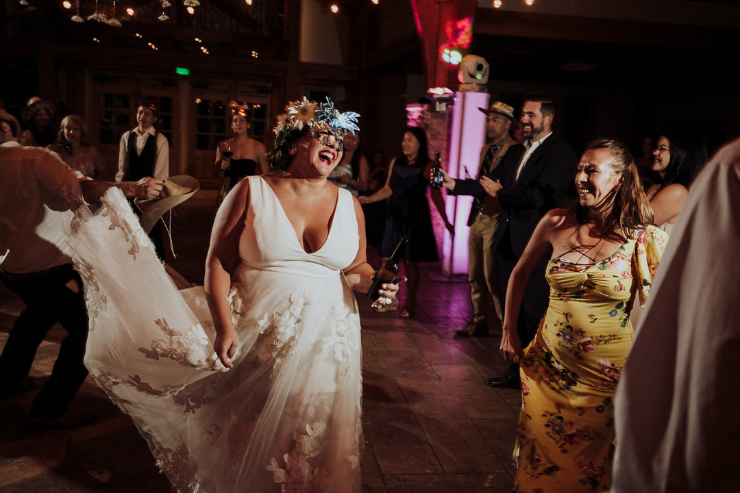 bride laughing on the dance floor