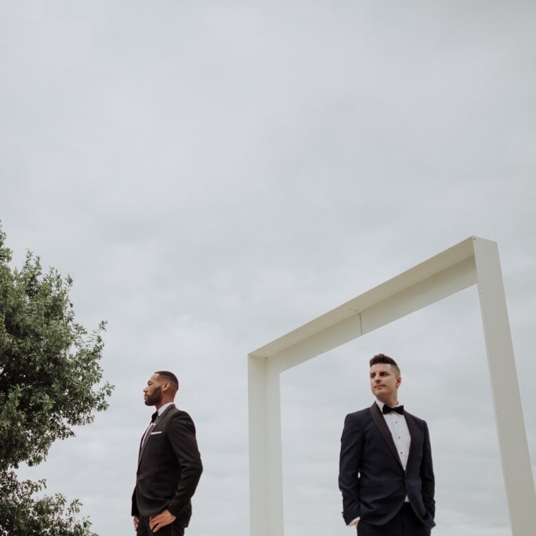 DeAndre and Stuart in wedding suits at Prospect House in Dripping Springs near Austin
